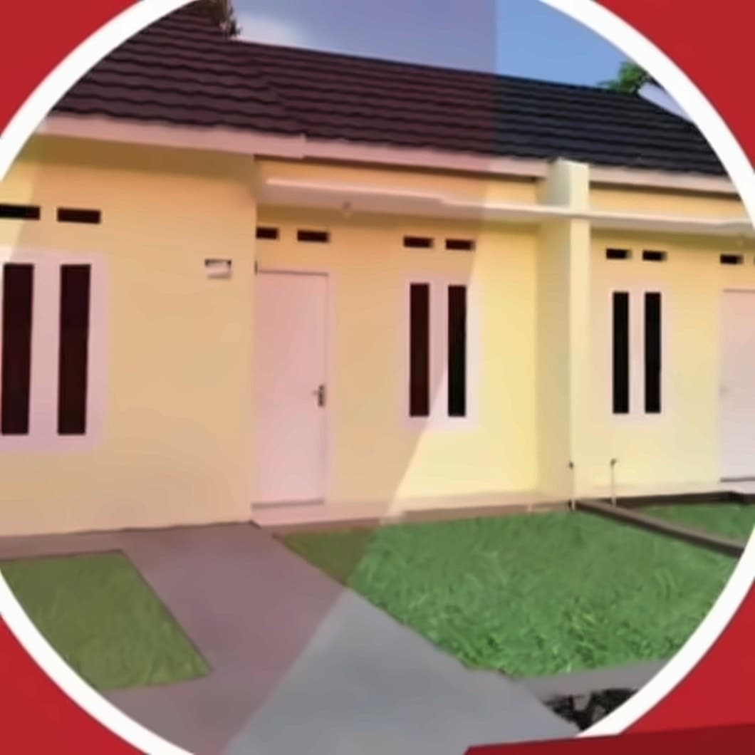 Deretan rumah subsidi Tipe 36 berwarna kuning dengan atap hitam dan halaman rumput di Perumahan Kenari Indah Makmur